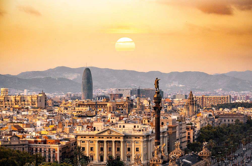 sun setting over the city of Barcelona